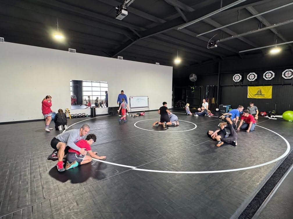 Wrestlers drilling on the mats at the Texans practice room in Argyle